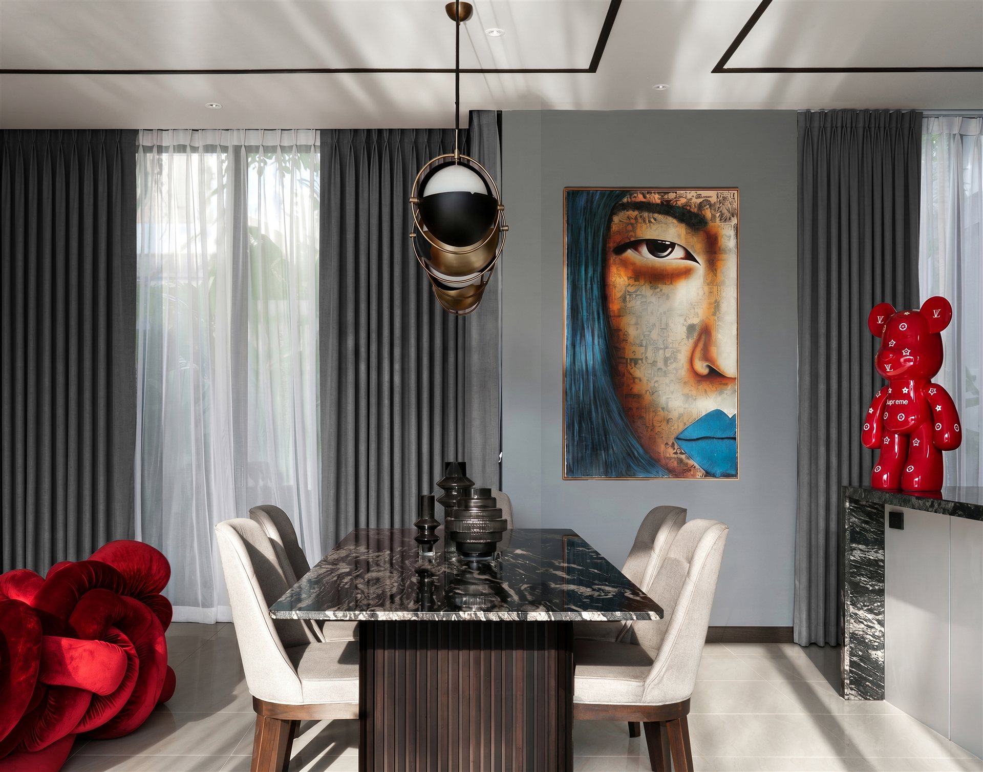 Ozone Villa dining room with statement art and sculptural lighting